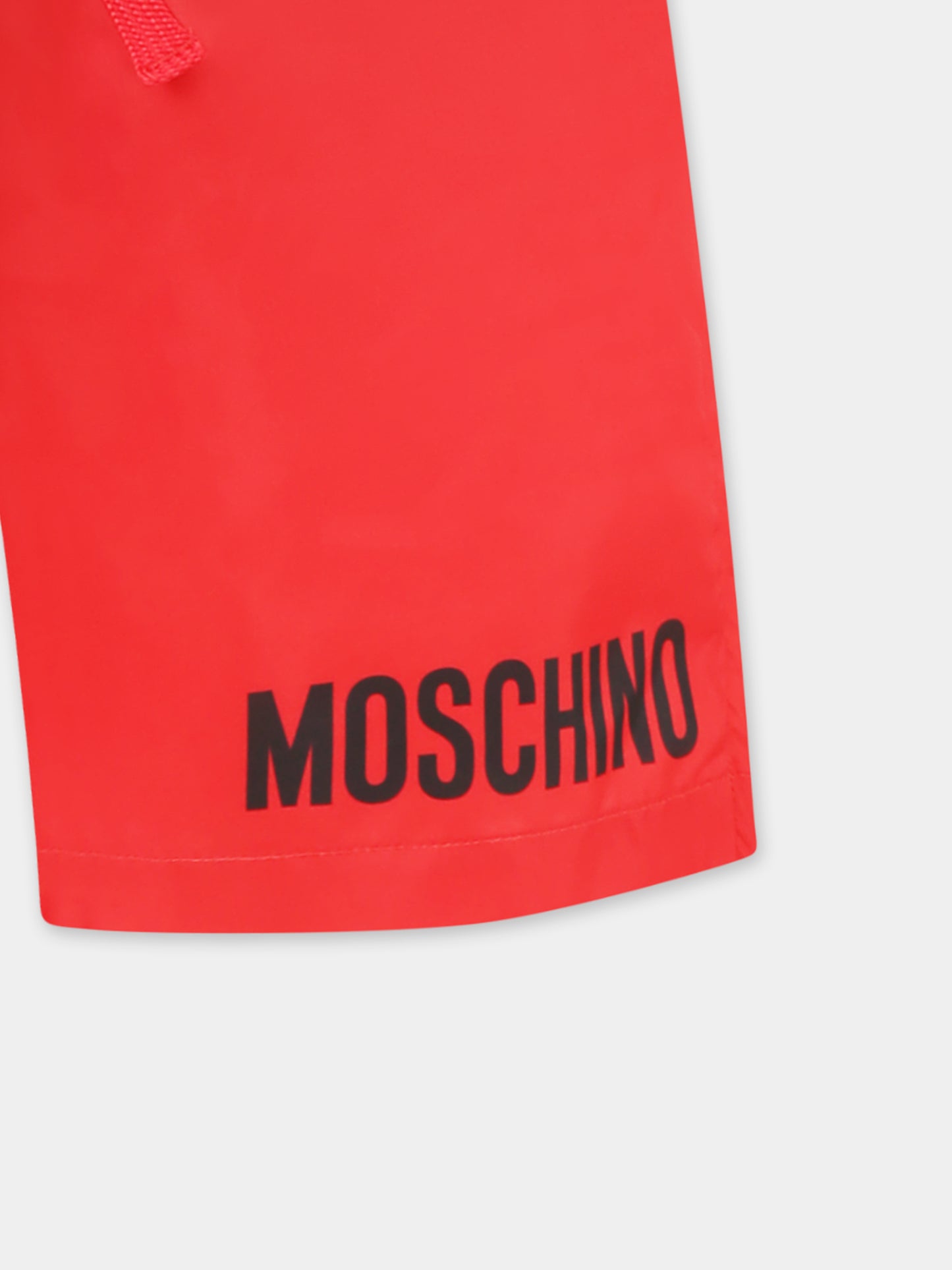 Red swim shorts for boy with logo