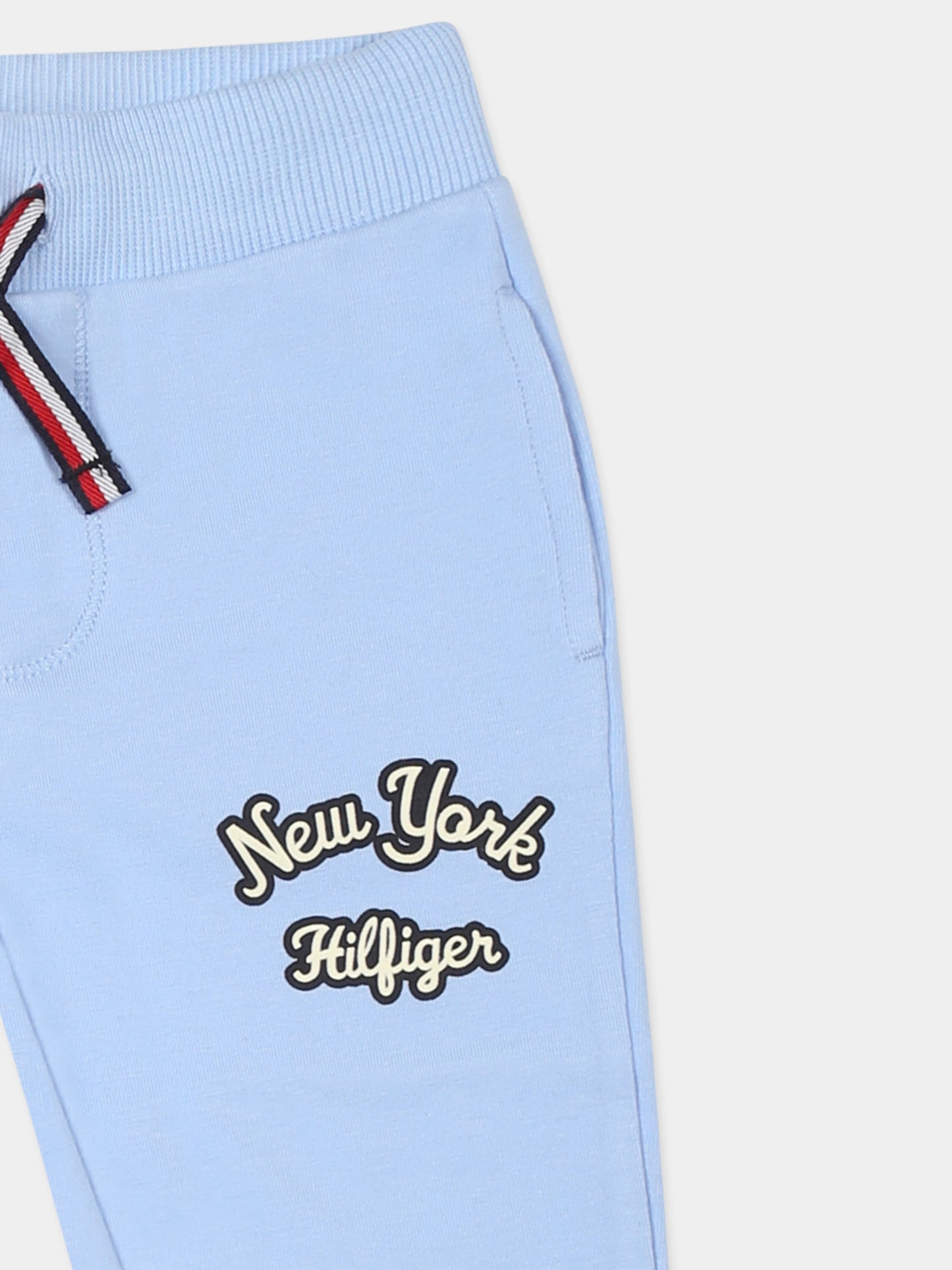 Light blue trousers for baby boy