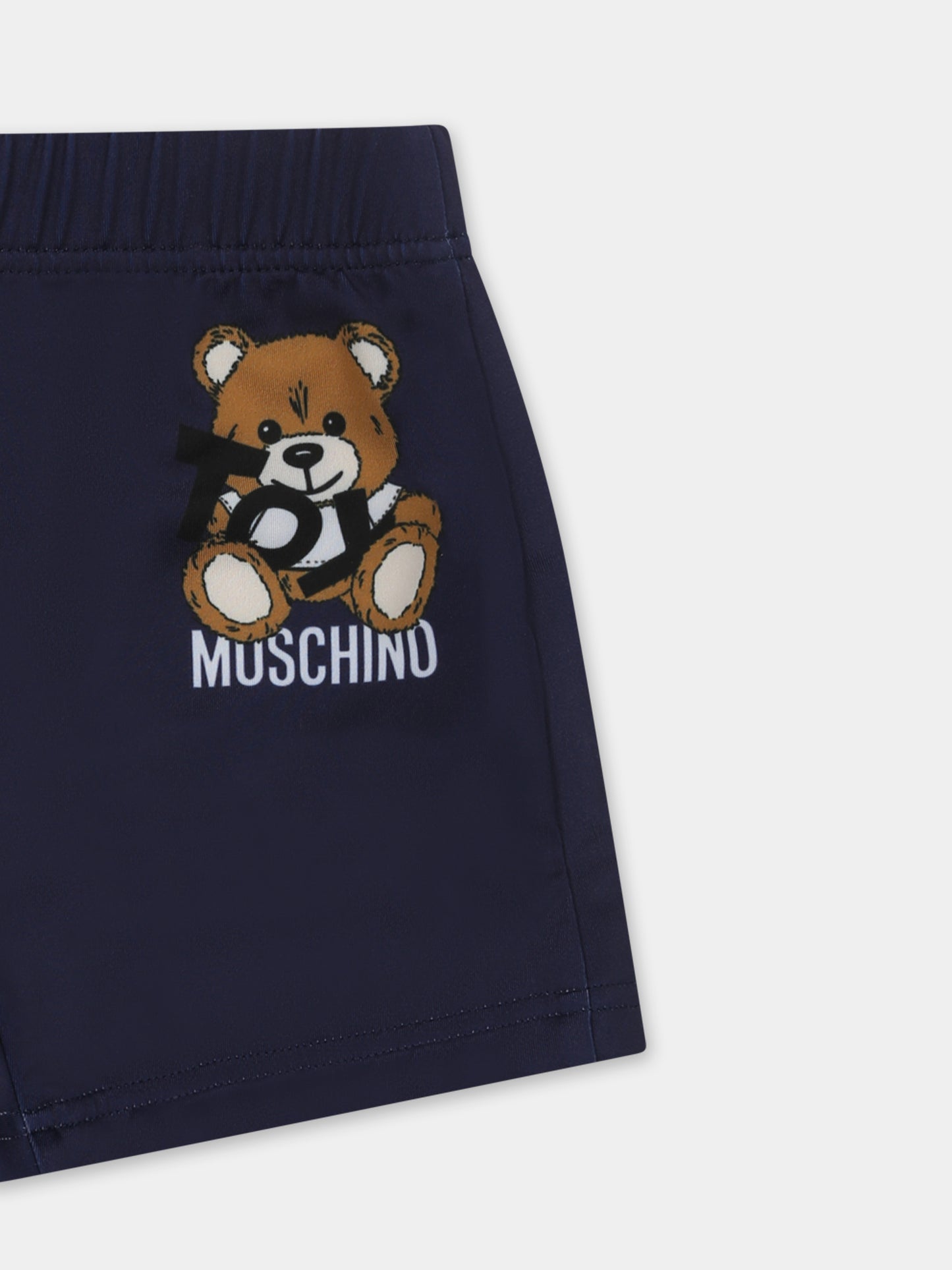 Blue swimsuit for babt boy with Teddy Bear and white logo